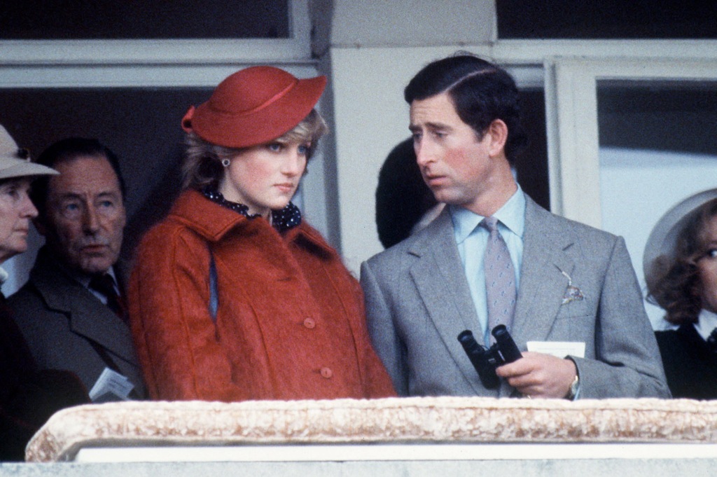 Princess Diana sitting next to Prince Charles. 