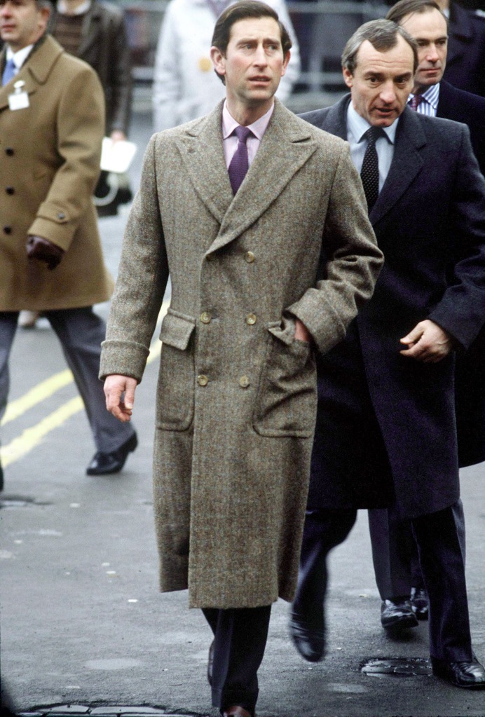 Prince Charles with bodyguard Barry Mannakee, walking. 