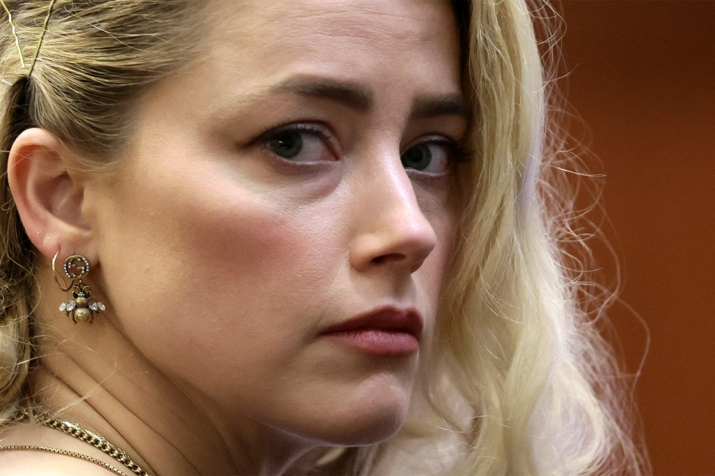 Amber Heard waits before the jury announced a split verdict in favor of both Johnny Depp and Heard on their claim and counter-claim in the Depp v. Heard civil defamation trial at the Fairfax County Circuit Courthouse in Fairfax, Virginia, on June 1, 2022. 