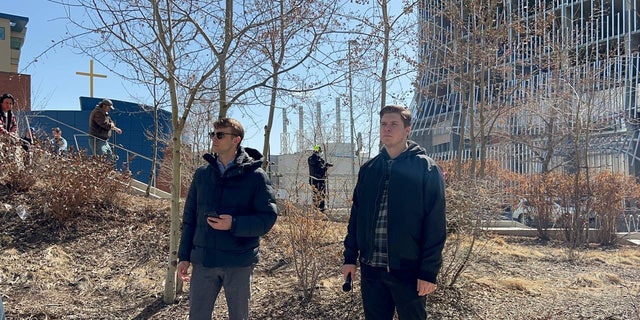 Nathaniel Pawlowski and friend Deklan Friesen address the crowd outside Calgary Public Library.