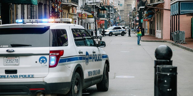 Police vehicles block access to Bourbon Street in New Orleans on Tuesday, Feb. 16, 2021. The city saw an increase in murders in 2022.