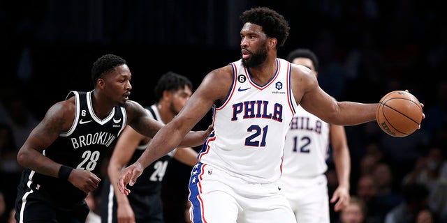 Joel Embiid dribbles during a playoff game