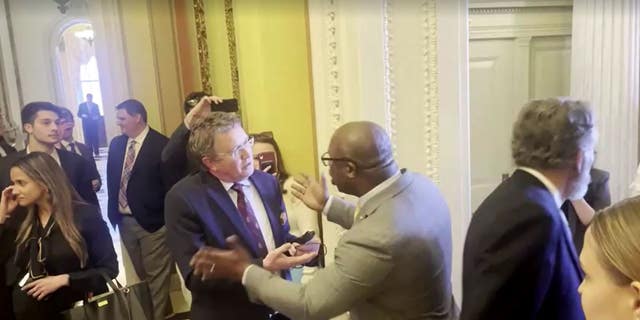 Reps. Thomas Massie, left, and Jamal Bowman got into a shouting match over gun control legislation while pacing the halls of Congress.