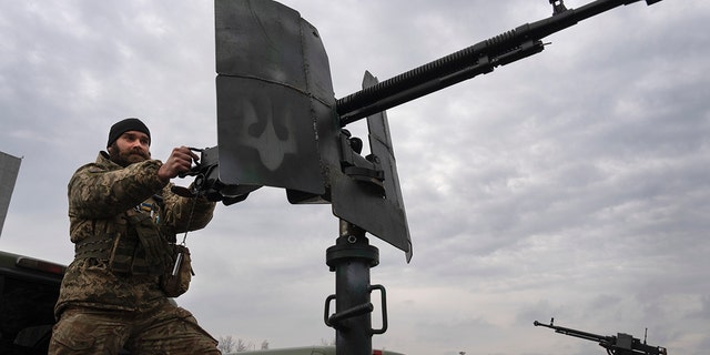 A Ukrainian soldier is seen at the Antonov airport in Hostomel, of Kyiv, Ukraine, Saturday, April 1, 2023. 