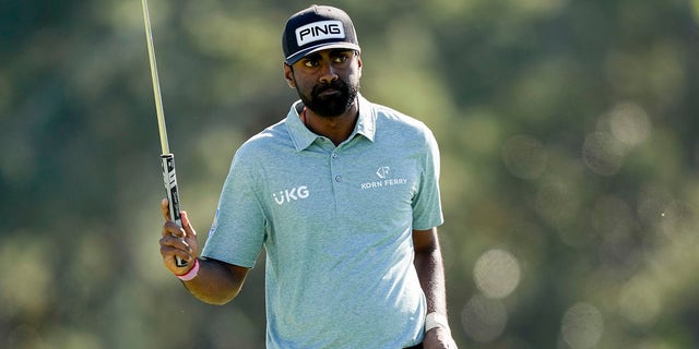 Sahith Theegala waves after his putt on the 18th hole during the final round of the Masters golf tournament at Augusta National Golf Club on Sunday, April 9, 2023, in Augusta, Ga.