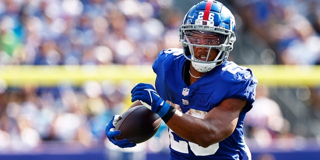 Saquon Barkley of the New York Giants in action against the Carolina Panthers during a game at MetLife Stadium Sept. 18, 2022, in East Rutherford, N.J.