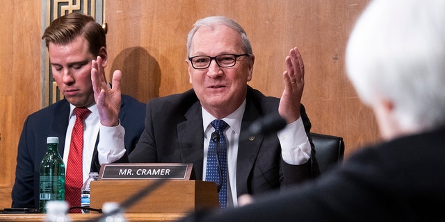 Sen. Kevin Cramer asks a question during a Senate banking committee hearing