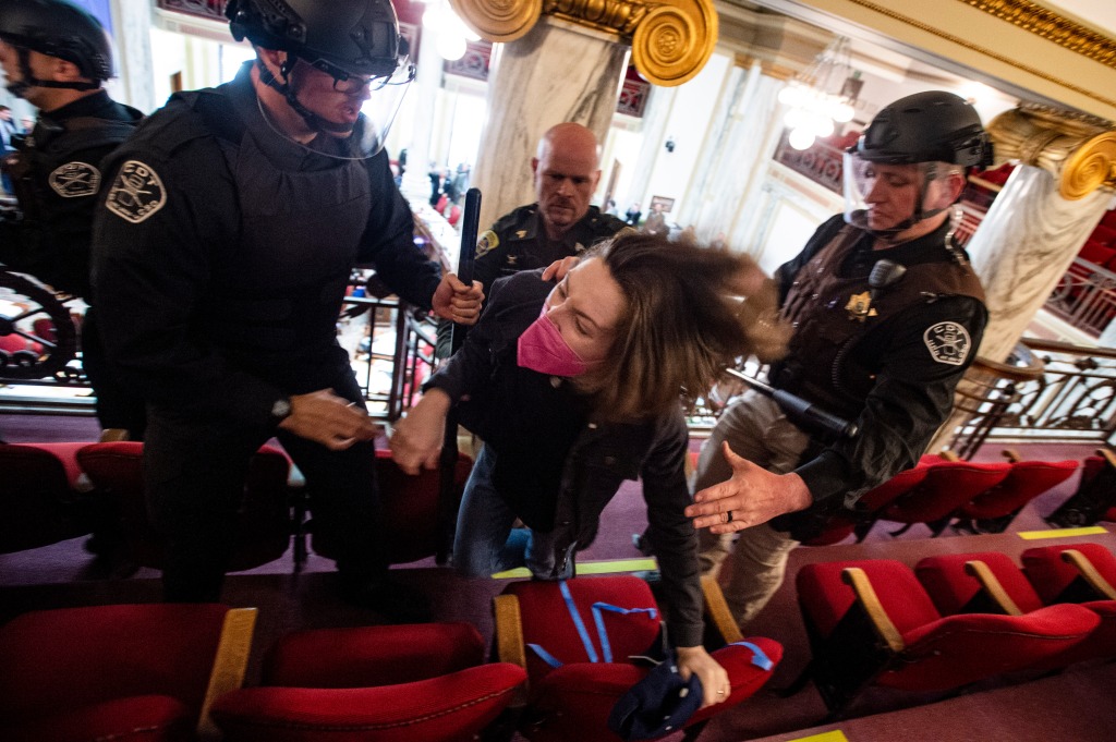 Law enforcement forcibly clear the Montana House of Representatives gallery during a protest after the Speaker of the House refused to acknowledge Rep. Zooey Zephyr on April 24, 2023, in Helena, Mont. 