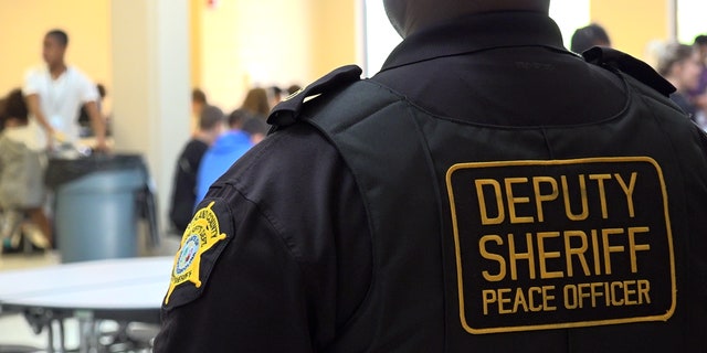 Officer watches over students at lunch