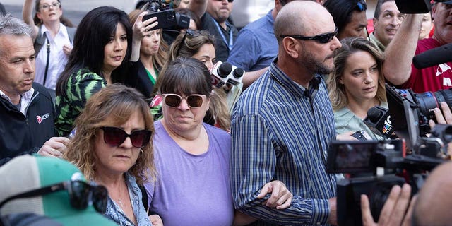 APRIL 14: Relatives of Jack Teixeira leave John Joseph Moakley United States Courthouse following his arraignment on April 14, 2023, in Boston, Massachusetts. Teixeria, a Massachusetts Air National Guardsman was charged on two counts: unauthorized retention and transmission of national defense information and unauthorized removal and retention of classified documents or material. 