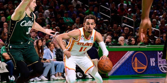 Trae Young (11) of the Atlanta Hawks drives to the basket during Game 1 of a 2023 NBA playoff series against the Boston Celtics April 15, 2023, at the TD Garden in Boston.