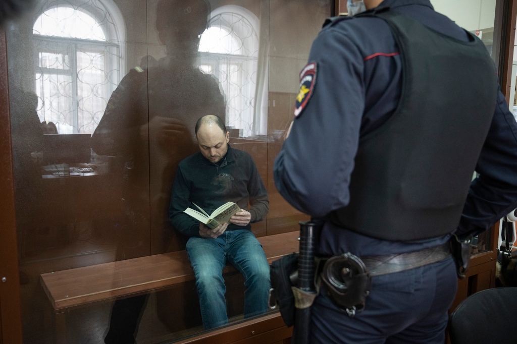 Kara-Murza sits in a cage in the courtroom prior to a court session in Moscow, Russia, Wednesday, Feb. 8, 2023.