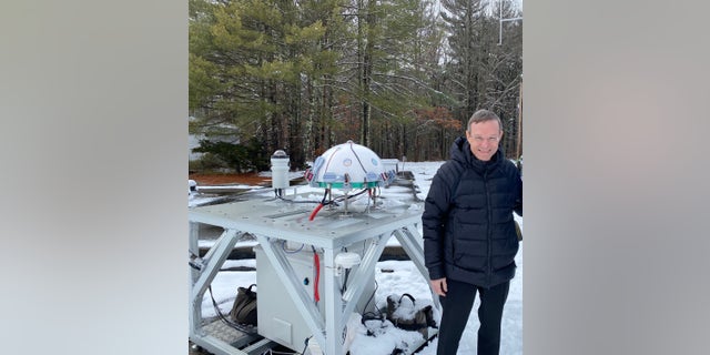 Harvard Professor Avi Loeb, of the Galileo Project, stands with the infrared and optical cameras of the Galileo Project Observatory