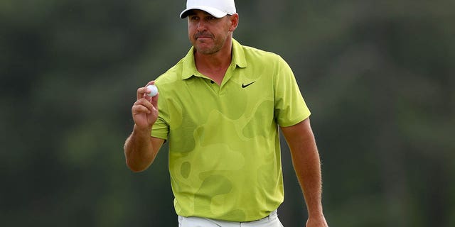 Brooks Koepka of the United States reacts to his birdie on the 18th green during the first round of the 2023 Masters Tournament at Augusta National Golf Club April 6, 2023, in Augusta, Ga.