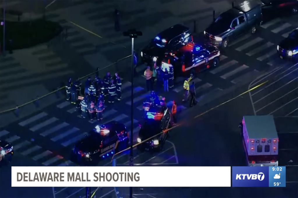 Police are spotted outside the mall after three people were shot in the food court area at the Christiana Mall on April 8, 2023. 