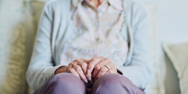 older woman on couch