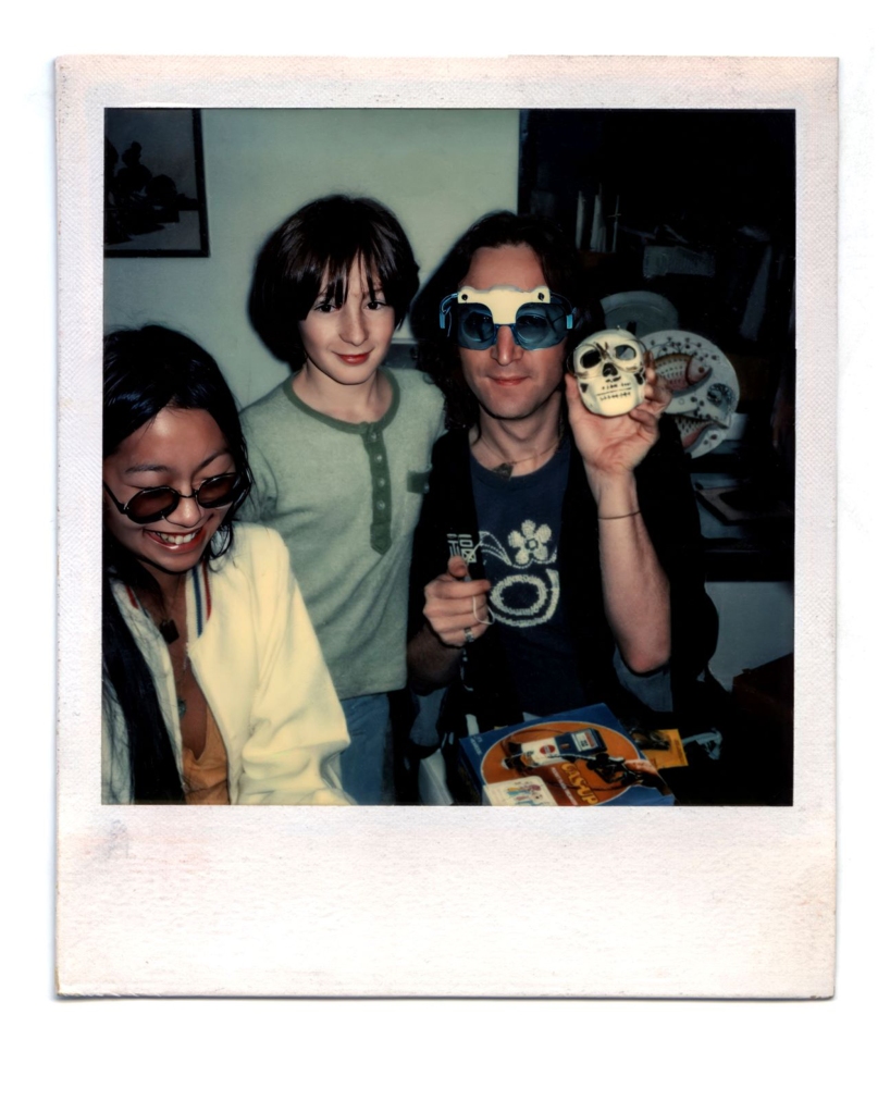 May Pang (left), John Lennon. Julian Lennon (center).