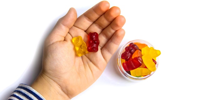 Kid's hand with gummies