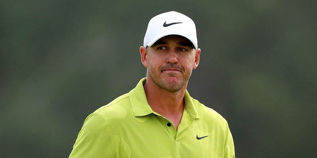 Brooks Koepka reacts to his birdie on the 18th green during the first round of the 2023 Masters Tournament at Augusta National Golf Club in Augusta, Georgia, on Thursday.