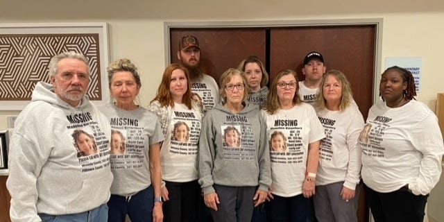 Madeline Kingsbury's family wearing custom made sweatshirts during their search with her description and contact information for tips