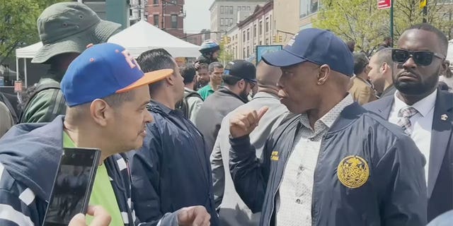 Eric Adams looks over his shoulder during Earth Day Event