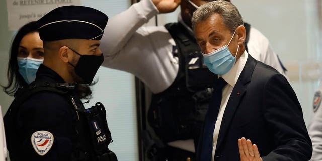  In this March 1, 2021 file photo, former French President Nicolas Sarkozy arrives at the courtroom in Paris. Former French President Nicolas Sarkozy was found guilty of illegal campaign financing of his unsuccessful 2012 reelection bid. (AP Photo/Michel Euler, File)