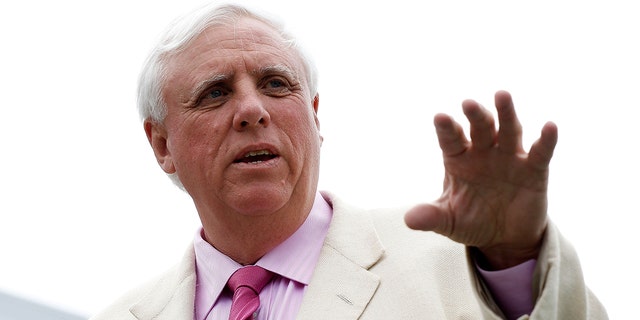 Jim Justice, owner of the Greenbrier Resort, looks over the 18th green during the first round of the Greenbrier Classic on The Old White Course at the Greenbrier Resort on July 29, 2010, in White Sulphur Springs, West Virginia.  