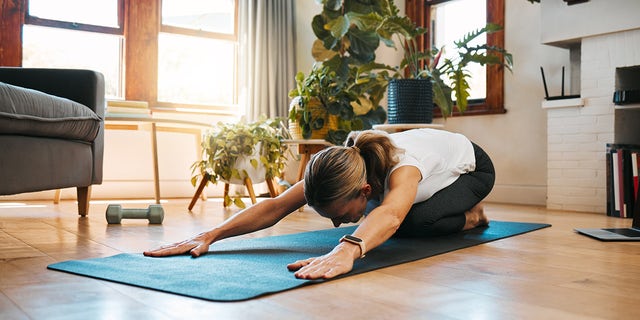 woman doing yoga health and fitness