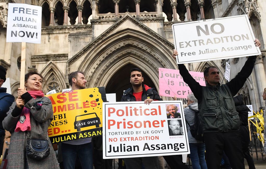 Julian Assange supporters gather outside the High Court in London, Britain in 2021. 