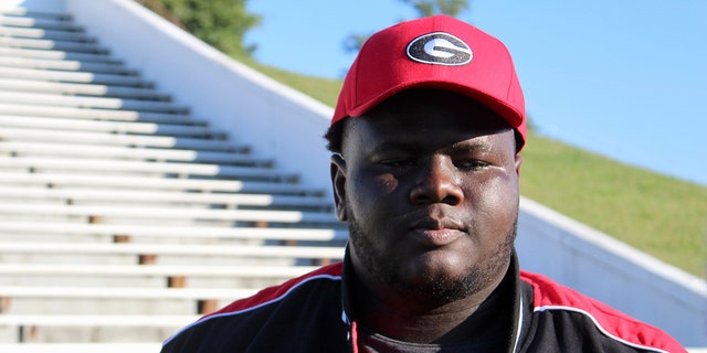 Jamaal Jarrett looks on with Georgia hat