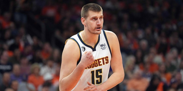 Nikola Jokic looks on