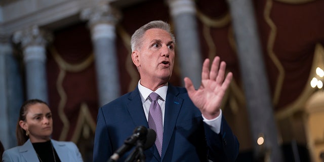 House Speaker Kevin McCarthy speaking with his hand up