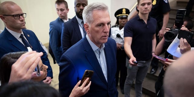 House Speaker Kevin McCarthy is surrounded by reporters