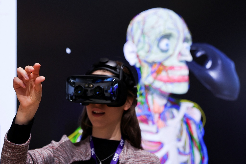 A person wears Varjo's human-eye resolution VR headset to learn human anatomy at the Varjo's Metaverse stand during the Mobile World Congress in Barcelona, Spain on Feb. 27, 2023.