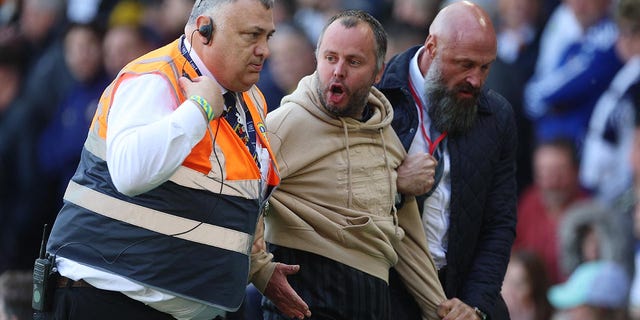 A fan is arrested after shoving Eddie Howe