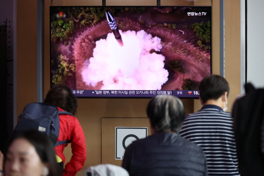 People watch a TV broadcasting a news report on North Korea firing what it called a space satellite toward the south, in Seoul, South Korea, on May 31, 2023. 