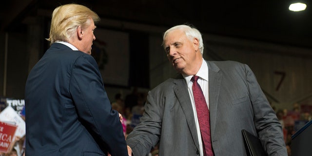 Trump and Jim Justice shake hands