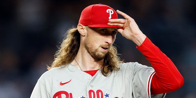 Matt Strahm fixes hat