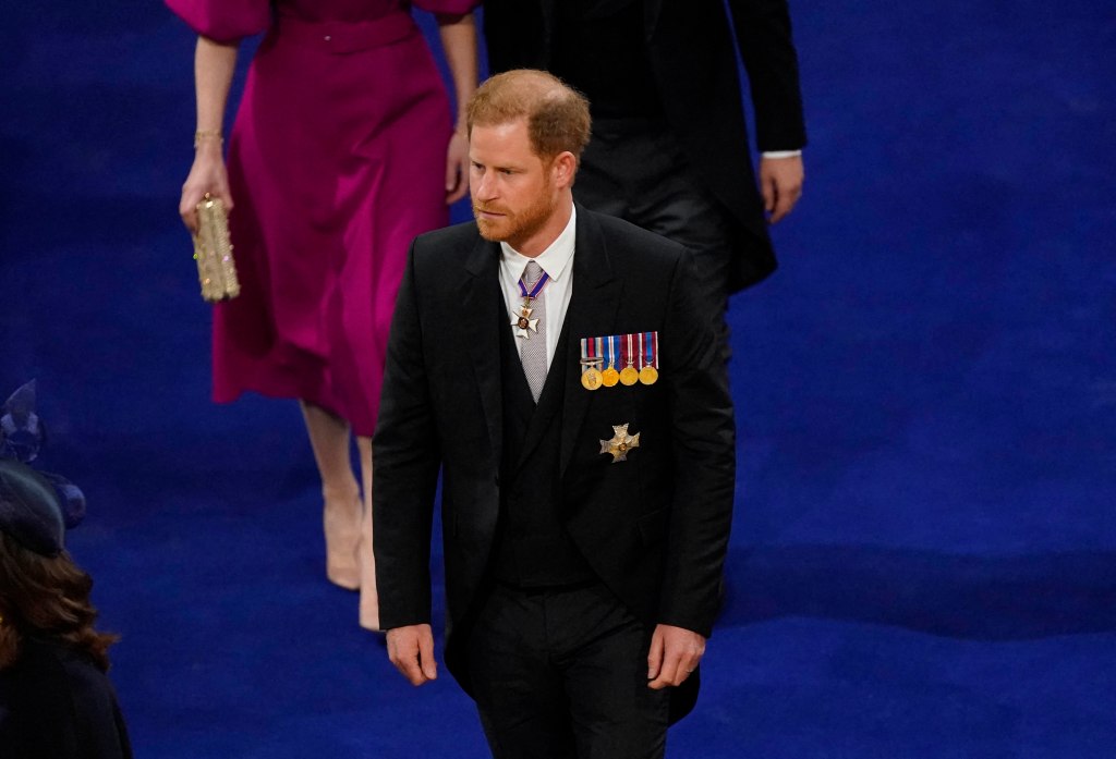 Prince Harry arrived to his father's coronation alone dressed in his morning suit.