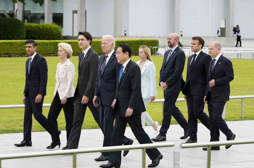 Leaders of the Group of Seven nations' meetings walk to a flower wreath laying ceremony at the Cenotaph for Atomic Bomb Victims in the Peace Memorial Park as part of the G7 Leaders' Summit in Hiroshima on May 19, 2023. 