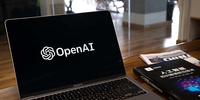 The OpenAI logo arranged on a laptop