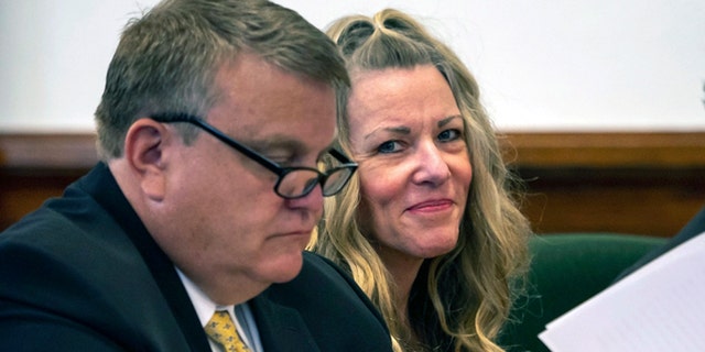 Lori Vallow Daybell, right, sits by an attorney for a hearing at an Idaho courthouse.