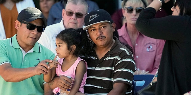 Cleveland, Texas, shooting survivor with daughter