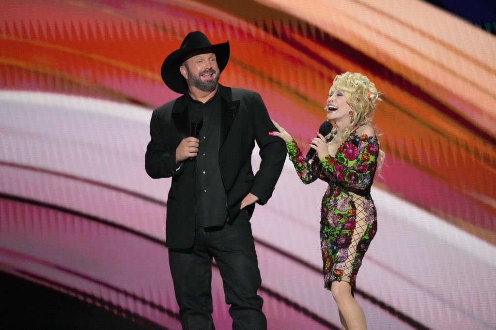 Hosts Garth Brooks, left, and Dolly Parton speak at the 58th annual Academy of Country Music Awards on May 11, 2023, at the Ford Center in Frisco, Texas.