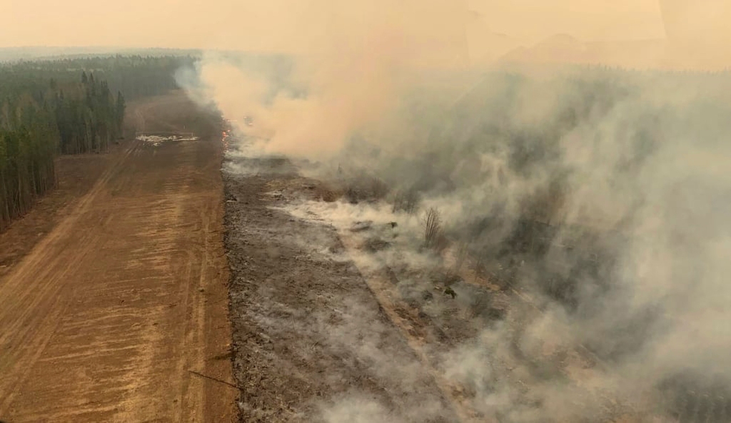 A burned section near a forest is seen on May 6, 2023, in the area near Edson, Alberta — where high temperatures could further flame the dozens of fires burning in Canada’s western Alberta province. 