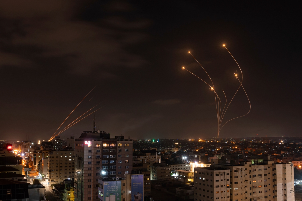 Rockets fired from Gaza and intercepted by Israel's Iron Dome anti-missile system over Israeli skies are seen from Gaza City.
