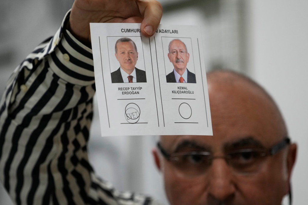 An election representative shows a ballot with a vote for the Turkish President and leader of the People's Alliance party Recep Tayyip Erdogan.