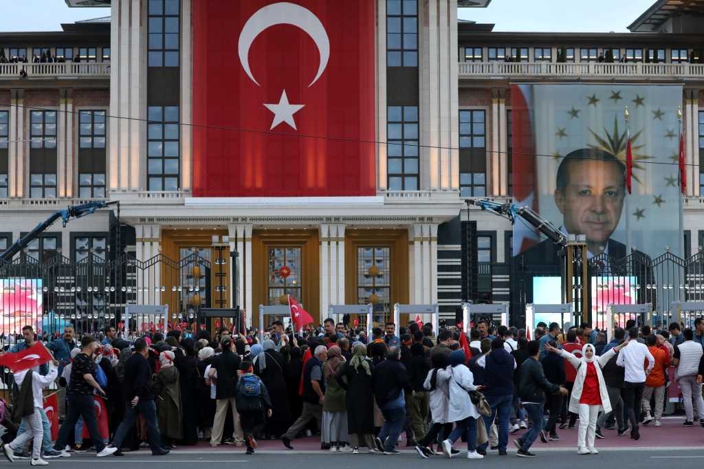 Supporters of the President Recep Tayyip Erdogan gather outside the Presidential Palace in Ankara.