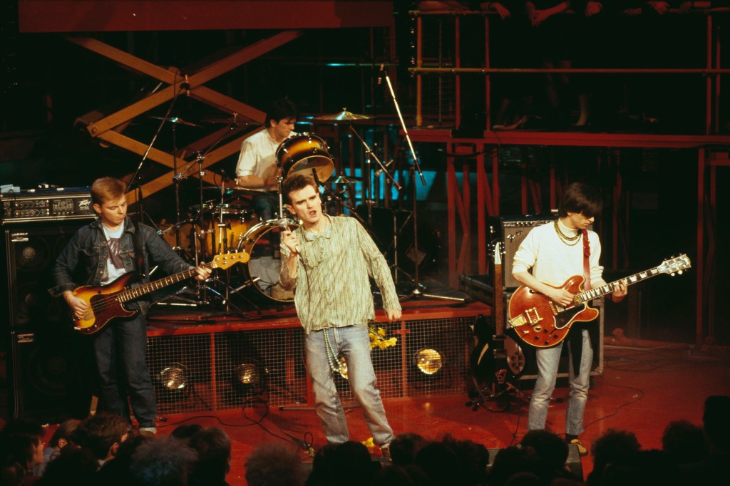 (L-R) Andy Rourke, Mike Joyce, Morrissey, and Johnny Marr performing live on stage in England on Jan. 1, 1984.