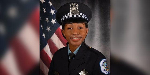 Areanah Preston in uniform in front of US flag